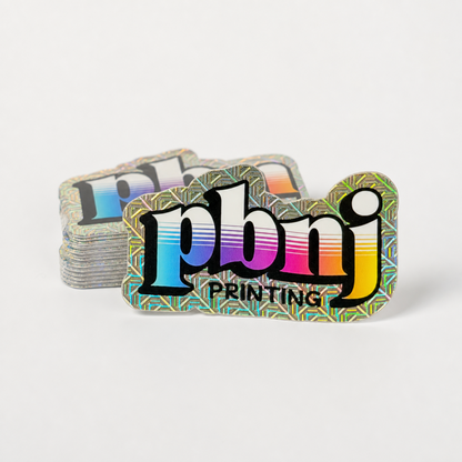 Stack of custom die cut stickers on Mojo holographic material