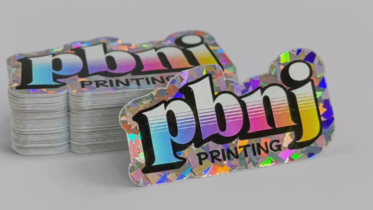 Load video: Custom holographic stickers shimmering in the light
